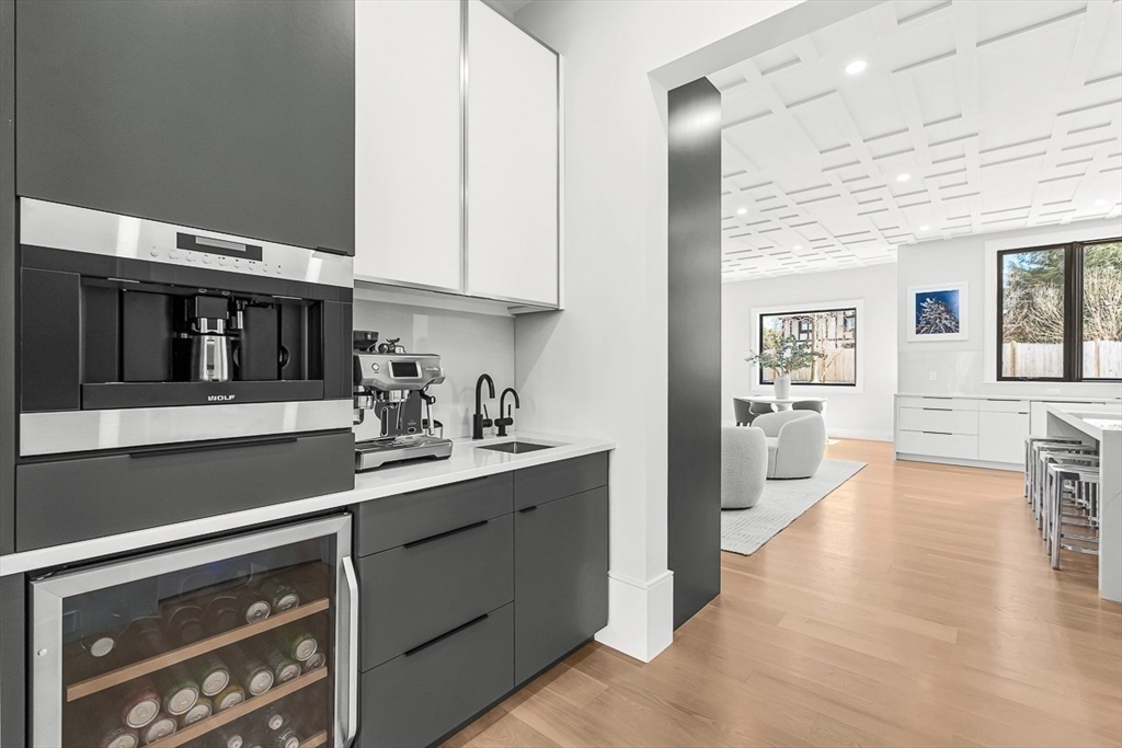180 Allen Avenue Newton, MA 02468 - Photo 11 of 36 a kitchen with stainless steel appliances a sink stove and cabinets