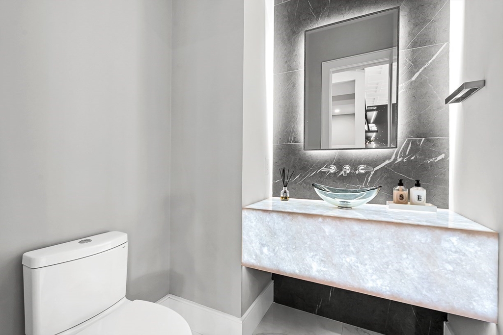 180 Allen Avenue Newton, MA 02468 - Photo 13 of 36 a bathroom with a granite countertop sink and a toilet