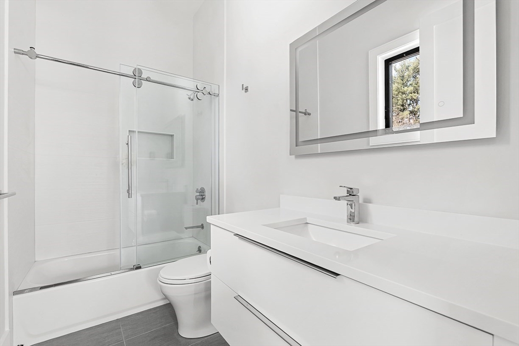180 Allen Avenue Newton, MA 02468 - Photo 25 of 36 a bathroom with a sink a toilet and shower