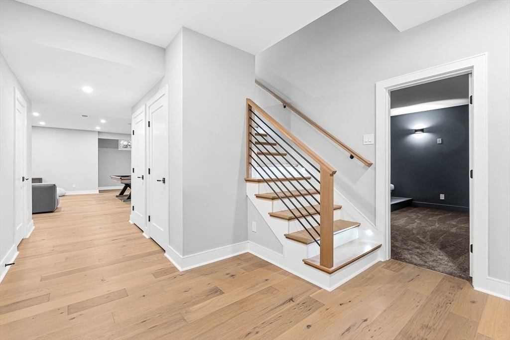 180 Allen Avenue Newton, MA 02468 - Photo 27 of 36 a view of a hallway with wooden floor and entryway
