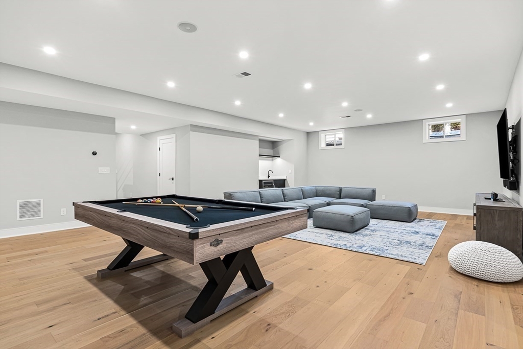 180 Allen Avenue Newton, MA 02468 - Photo 29 of 36 a living room with furniture and a flat screen tv