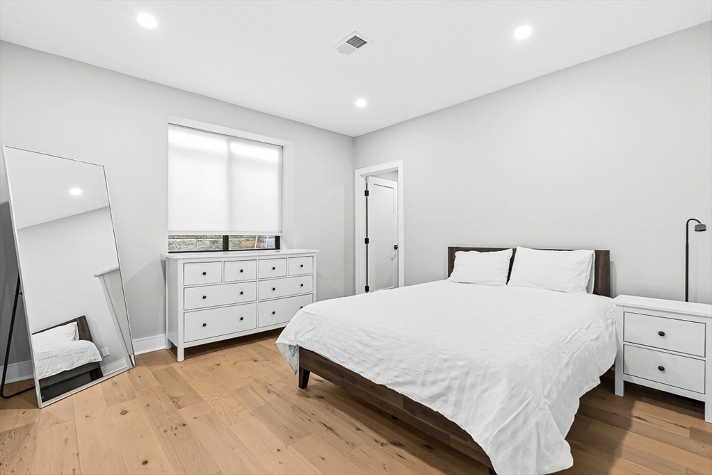 180 Allen Avenue Newton, MA 02468 - Photo 31 of 36 a bedroom with a bed and a closet