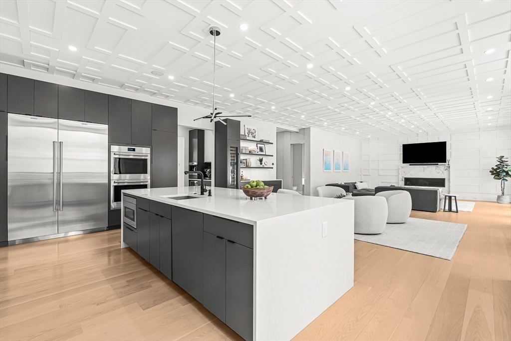 180 Allen Avenue Newton, MA 02468 - Photo 4 of 36 a large room with kitchen view