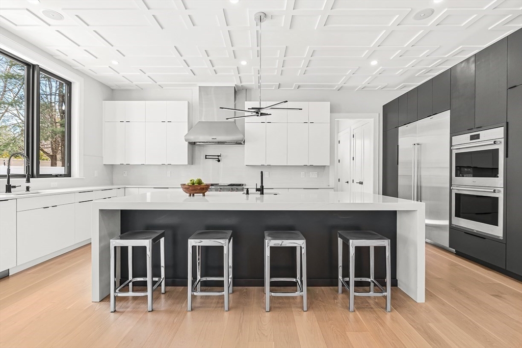 180 Allen Avenue Newton, MA 02468 - Photo 5 of 36 a kitchen with a sink cabinets and wooden floor