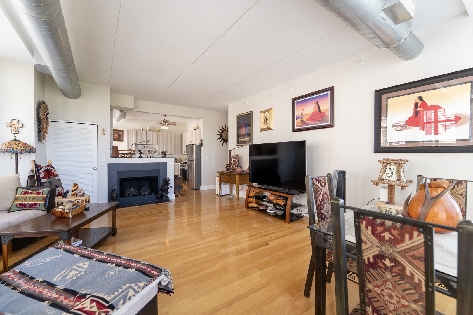 1 South Highland Avenue, Unit 400 Arlington Heights, IL 60005 - Photo 5 of 24 a living room with furniture and a flat screen tv