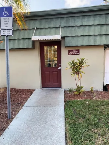 a view of a house with a tree