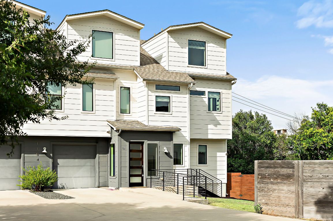 1104 Marcy Street, Unit B Austin, TX 78745 - Photo 2 of 34 a front view of a house with a yard