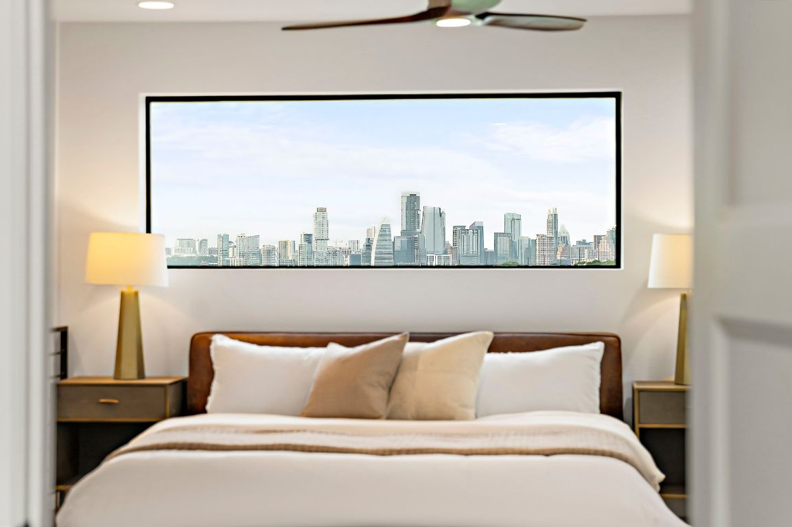 1104 Marcy Street, Unit B Austin, TX 78745 - Photo 21 of 34 a bed sitting in a bedroom next to a window