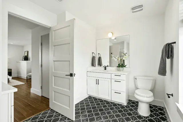 a bathroom with a bathtub sink a mirror and shower