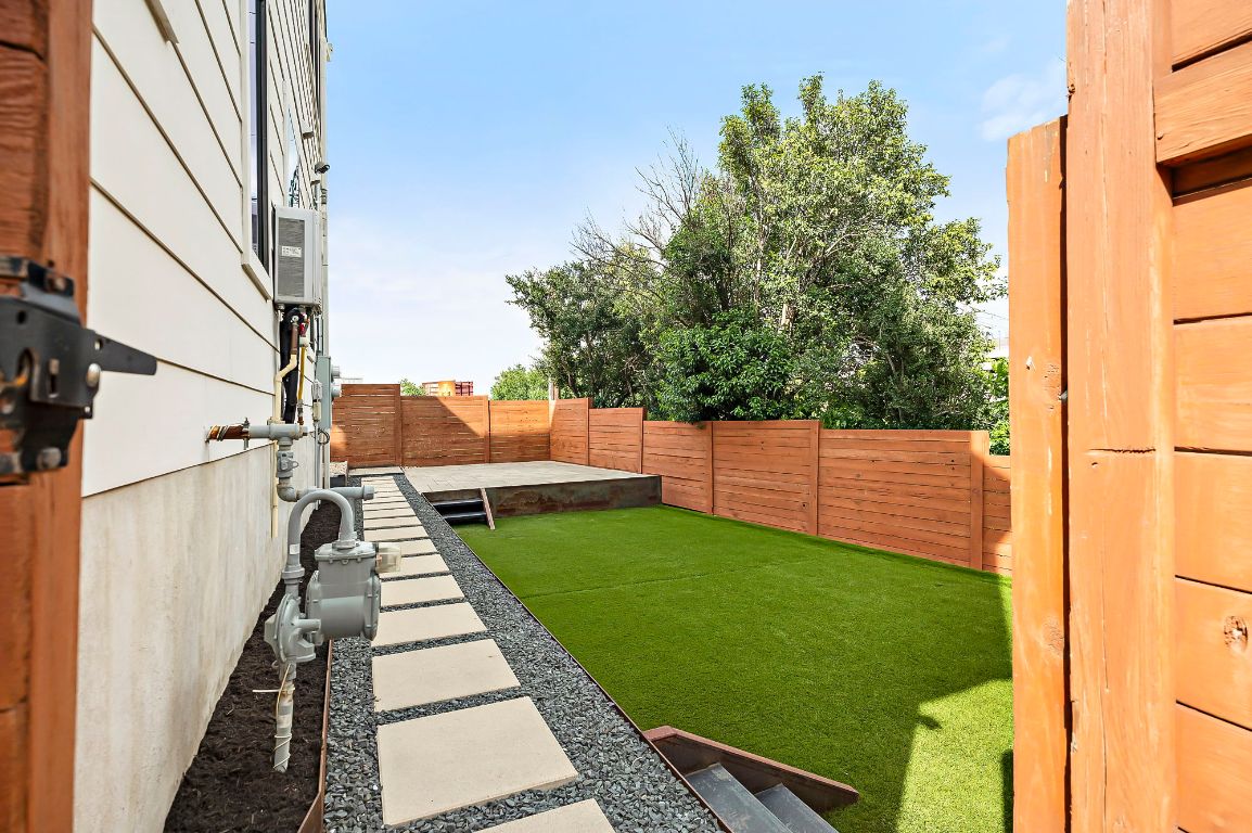 1104 Marcy Street, Unit B Austin, TX 78745 - Photo 28 of 34 a backyard of a house with seating space