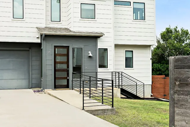 a front view of a house with garage