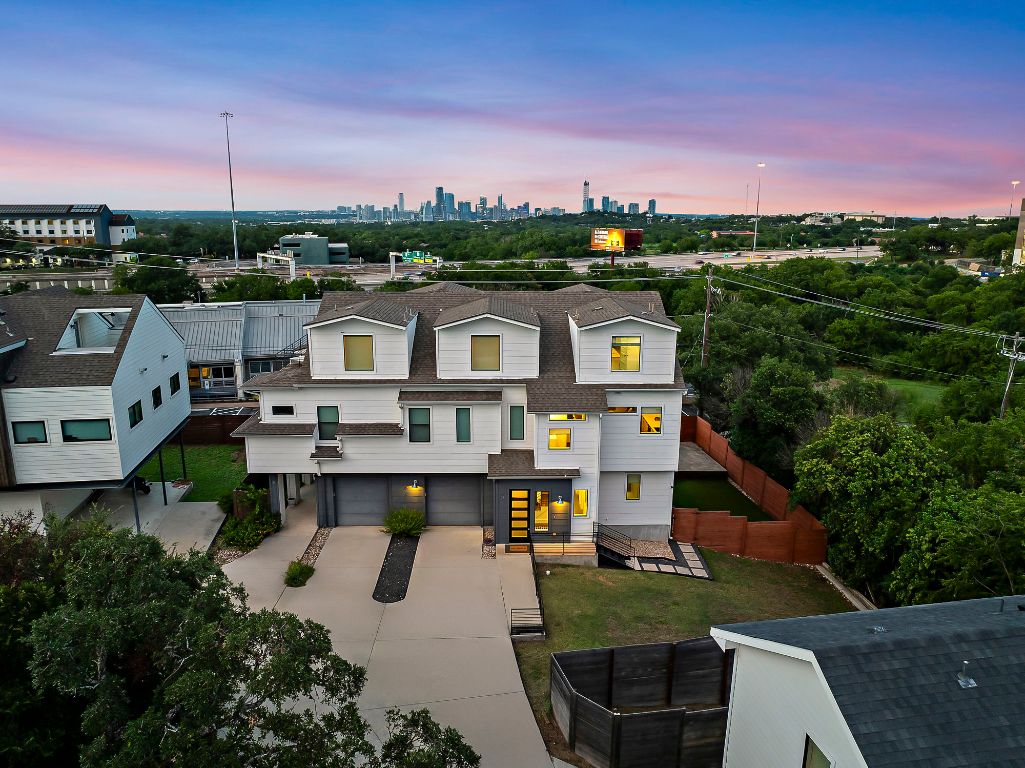 1104 Marcy Street, Unit B Austin, TX 78745 - Photo 32 of 34 a view of a city with tall buildings and a cars park in front of it