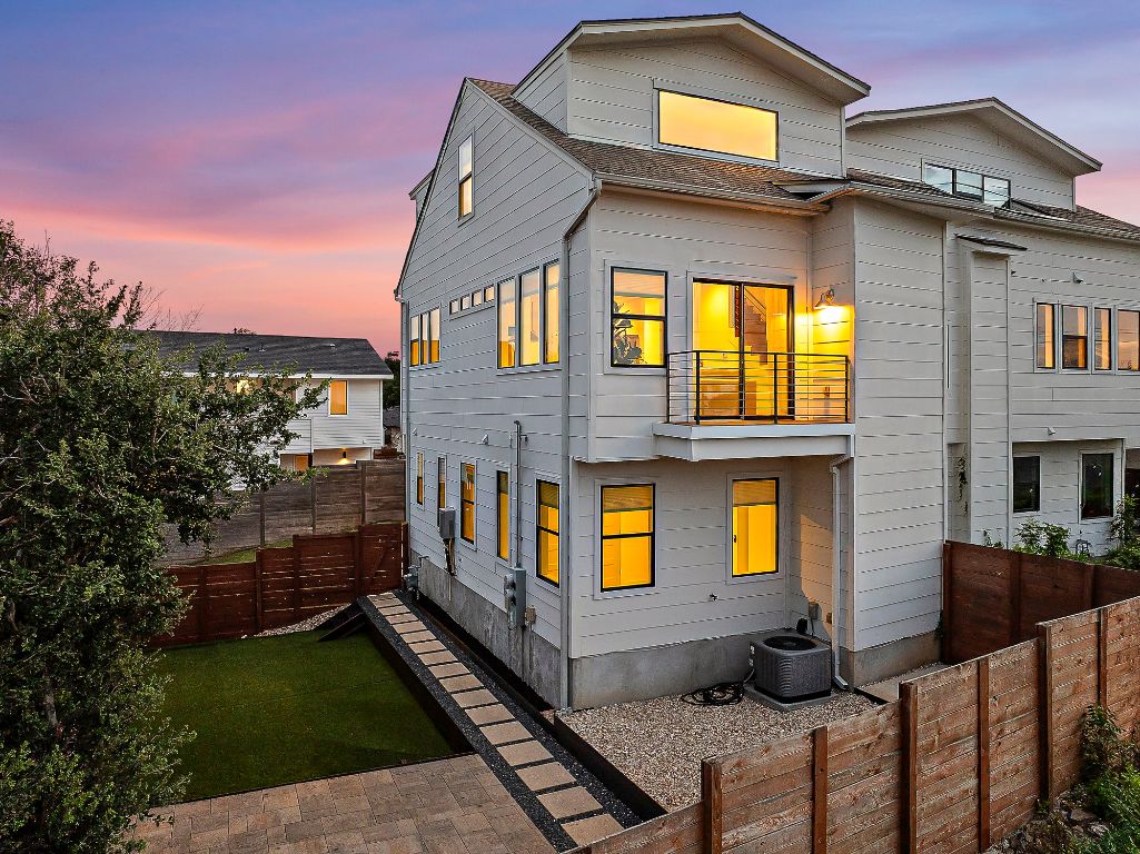 1104 Marcy Street, Unit B Austin, TX 78745 - Photo 33 of 34 a front view of a house with barbeque and outdoor seating