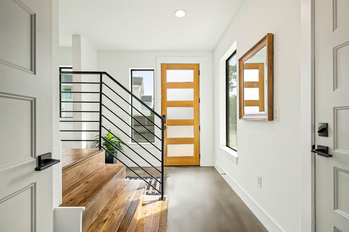 1104 Marcy Street, Unit B Austin, TX 78745 - Photo 4 of 34 a view of entryway with wooden floor and windows