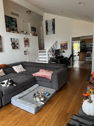 a living room with furniture and flat screen tv
