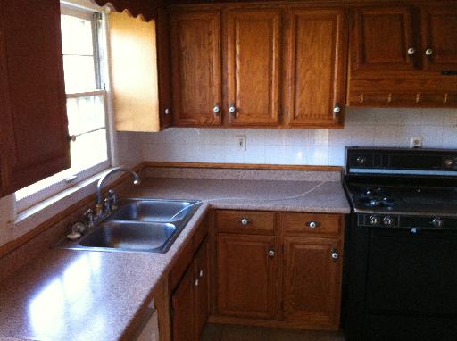 23 Woodcliff Road Montgomery, IL 60538 - Photo 8 of 16 a kitchen with a sink cabinets and window