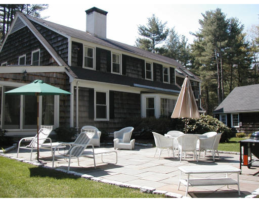 17 Round Hill Road Weston, MA 02493 - Photo 11 of 17 a building outdoor space with patio furniture and potted plants