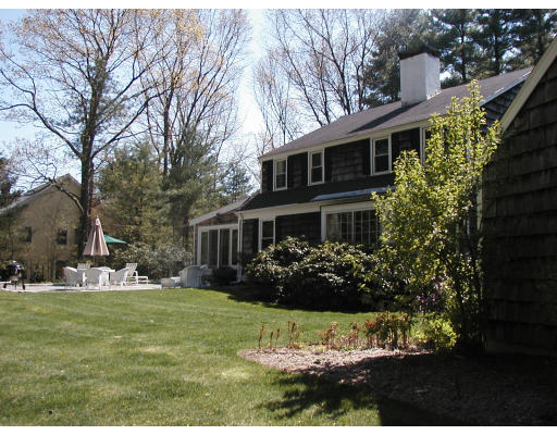 17 Round Hill Road Weston, MA 02493 - Photo 12 of 17 a front view of a house with a yard