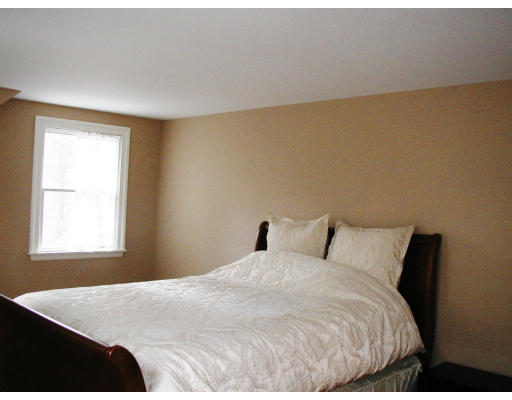 17 Round Hill Road Weston, MA 02493 - Photo 7 of 17 a bedroom with a bed and a window