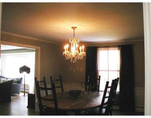 17 Round Hill Road Weston, MA 02493 - Photo 8 of 17 a view of a dining room with furniture and a chandelier