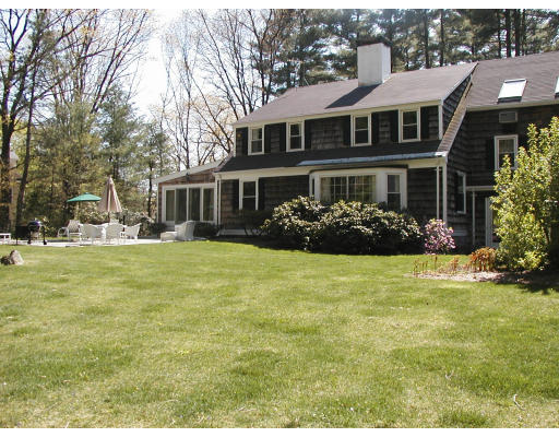 17 Round Hill Road Weston, MA 02493 - Photo 9 of 17 a front view of house with yard and trees around