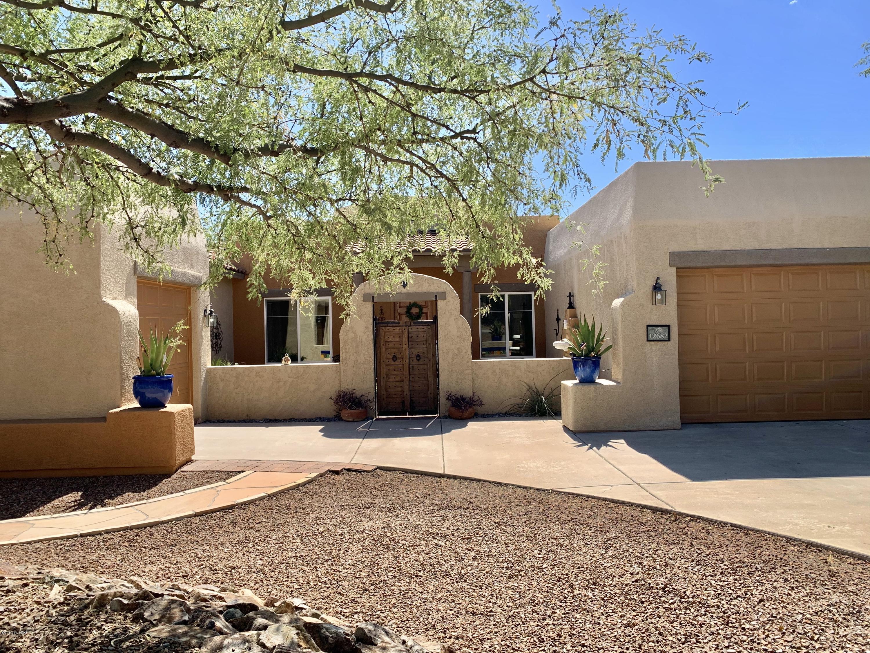 12682 North Spirit Mountain Road Oro Valley, AZ 85755 - Photo 16 of 40 a view of a house with a snow in the yard