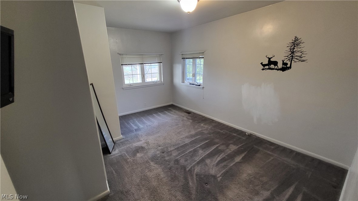 72238 Colerain Road Bridgeport, OH 43912 - Photo 20 of 30 Spare room featuring dark carpet