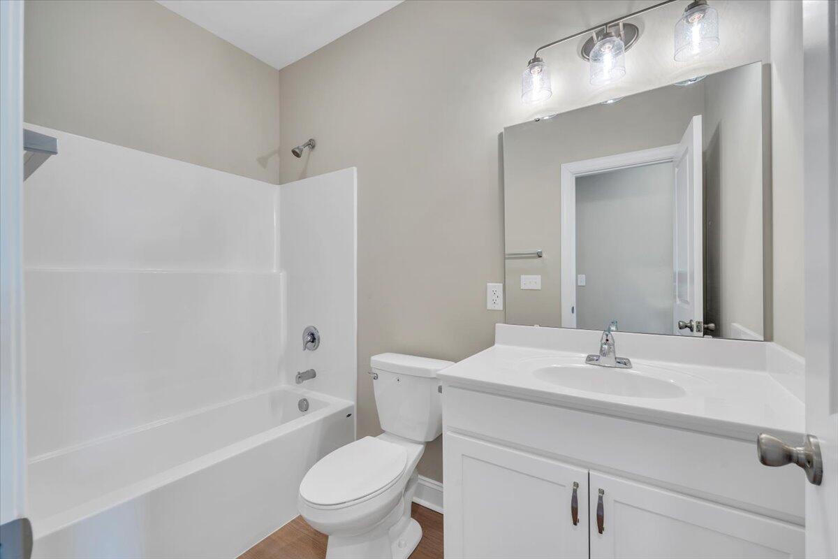 5709 Huntridge Road Roanoke, VA 24019 - Photo 16 of 21 a bathroom with a sink toilet and shower