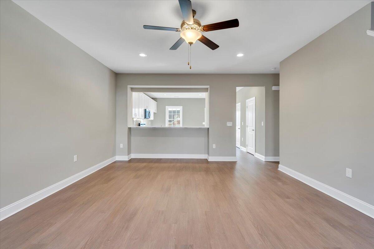 5709 Huntridge Road Roanoke, VA 24019 - Photo 4 of 21 an empty room with wooden floor and windows