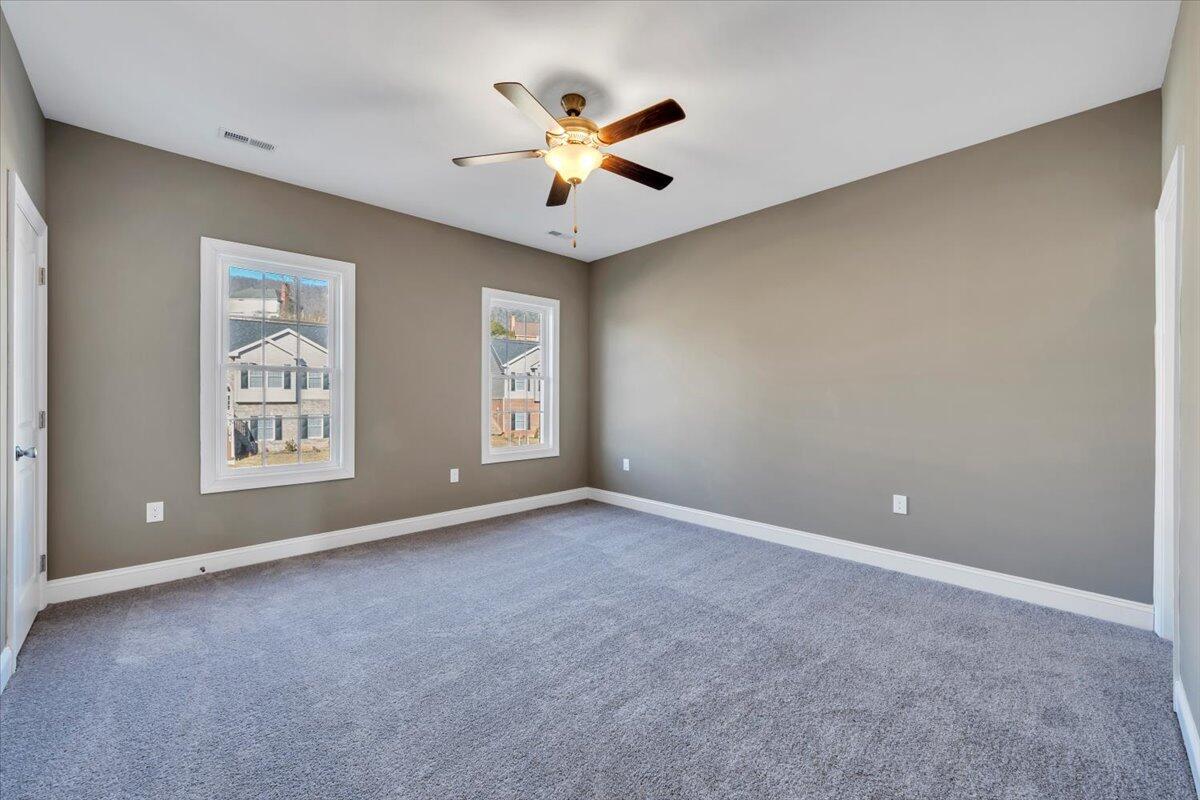 5709 Huntridge Road Roanoke, VA 24019 - Photo 10 of 21 an empty room with window and ceiling fan