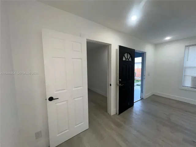 a kitchen with a sink appliances and cabinets