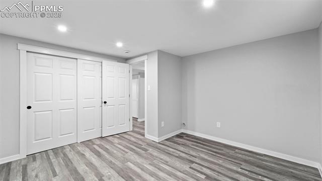 562 Blossom Field Road Fountain, CO 80817 - Photo 22 of 41 3rd bedroom with light wood-type flooring, a closet, and recessed lighting