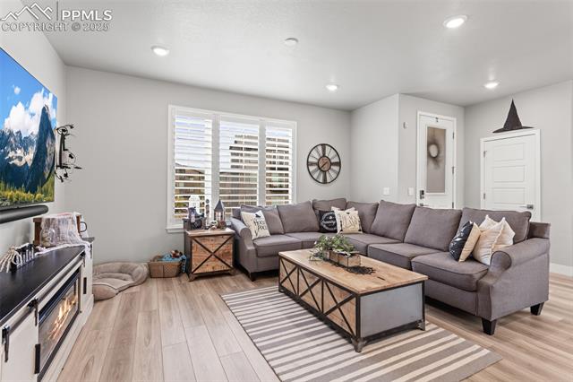 8258 Mount Ouray Road Littleton, CO 80125 - Photo 4 of 28 Living room with light hardwood / wood-style floors