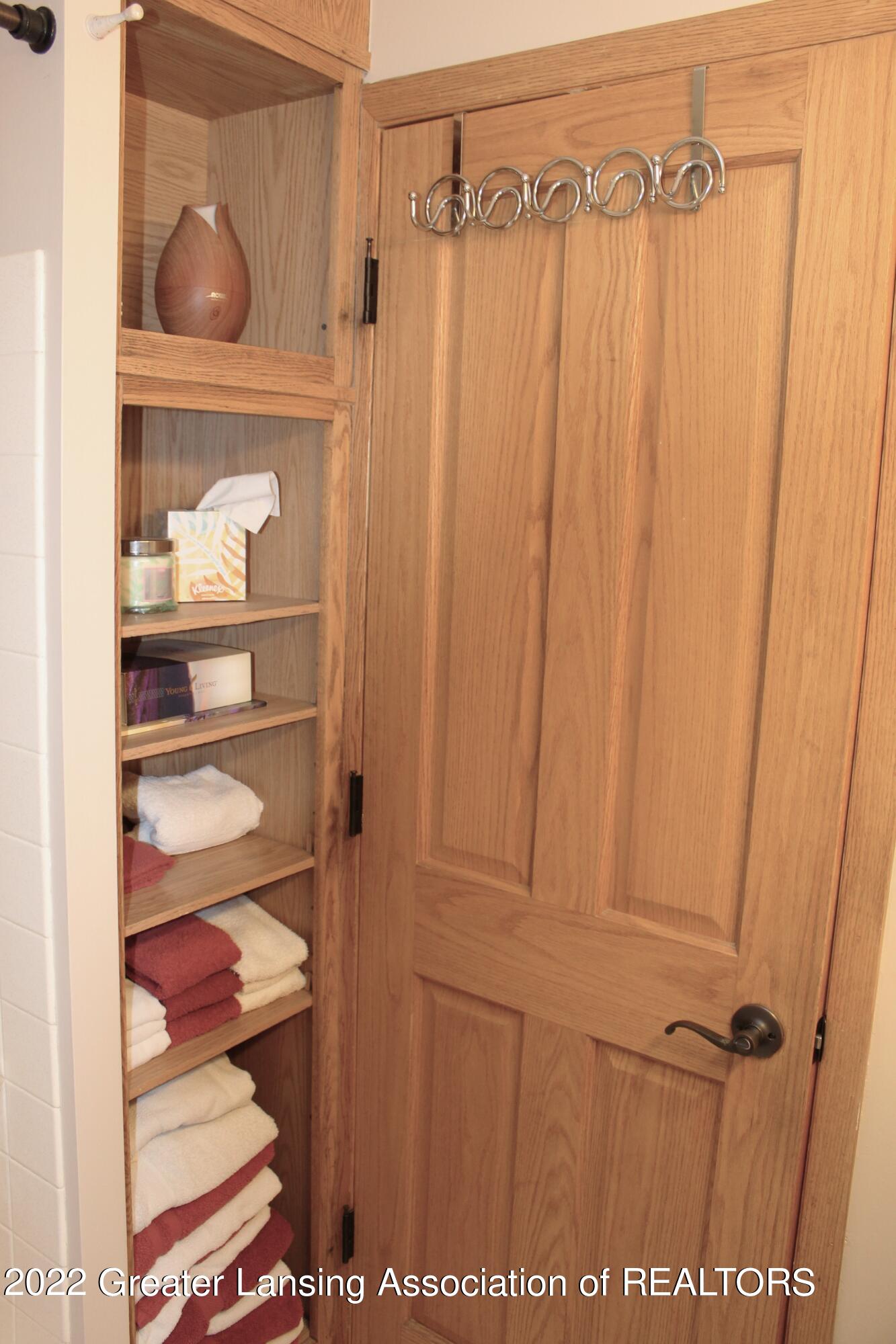 4254 Hulett Road Okemos, MI 48864 - Photo 30 of 43 2nd bath linen shelves