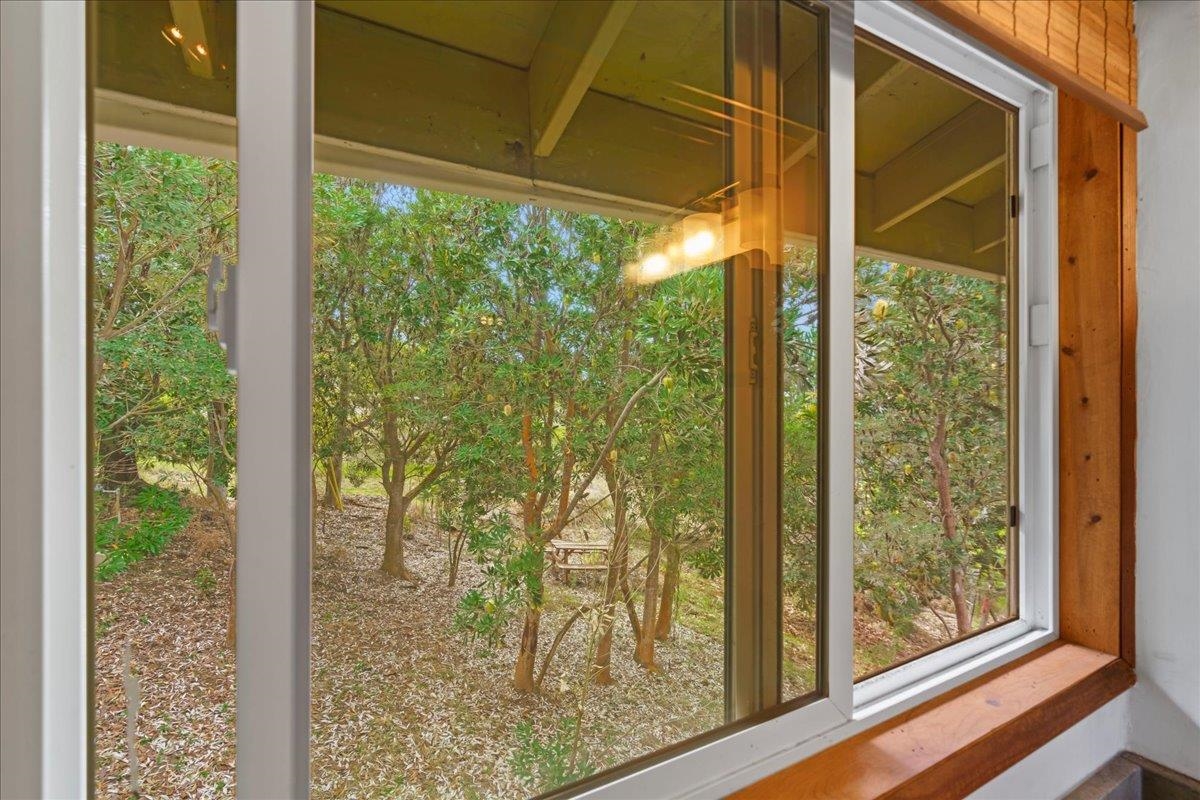 31 Hapapa Road, Unit B Kula, HI 96790 - Photo 32 of 50 a view of a room with a large window and wooden floor