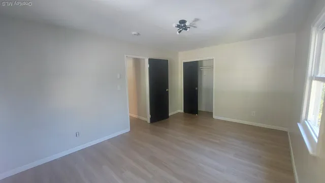 a view of an empty room with a window