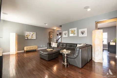 a kitchen with granite countertop white cabinets white appliances and sink
