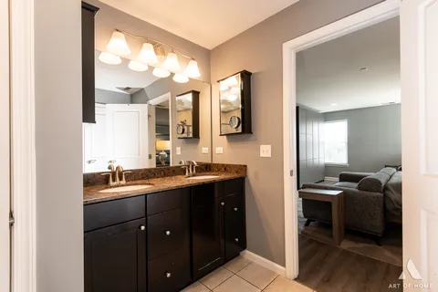 a view of a storage and utility room with dryer and washer