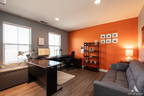 a view of a house with snow on the road