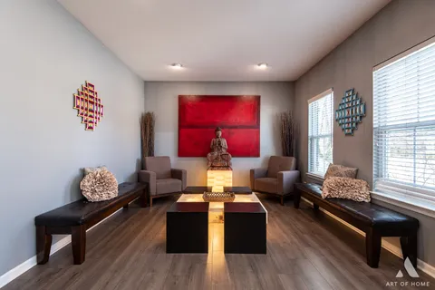 a view of a dining room with furniture and wooden floor