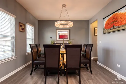 a living room with furniture fireplace and a table