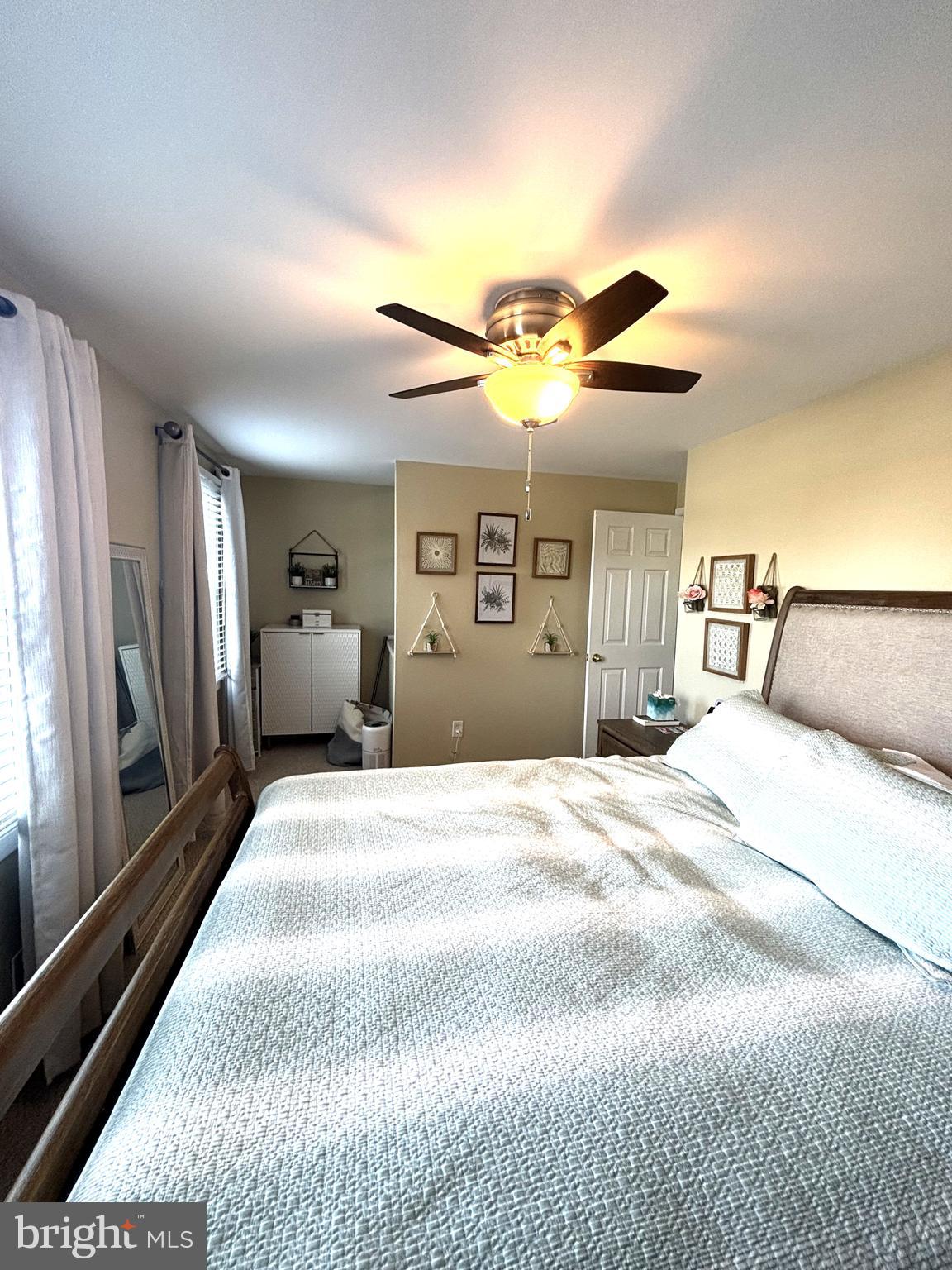 1404 St Francis Road Bel Air, MD 21014 - Photo 19 of 23 a bedroom with a large bed and a chandelier