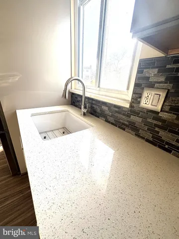 a bathroom with a bathtub and a sink