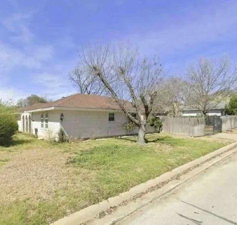 a house view with a garden space