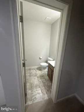 a bathroom with a bathtub and toilet