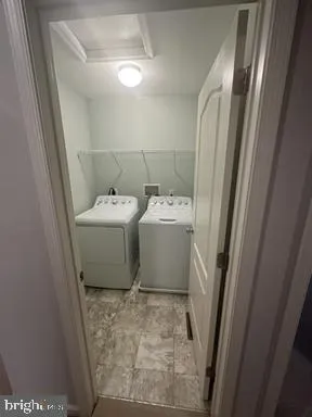 a large kitchen with kitchen island a sink stainless steel appliances and cabinets