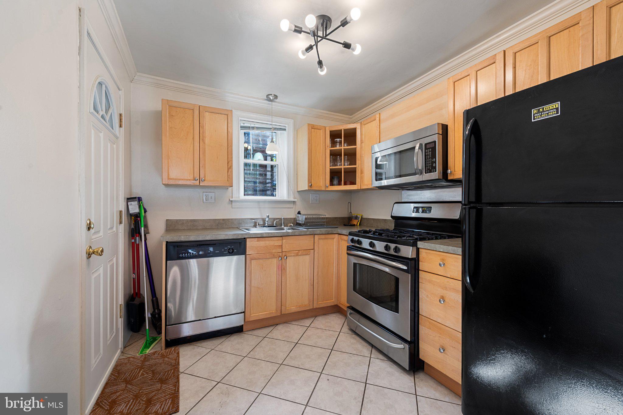 211 South Madeira Street Baltimore, MD 21231 - Photo 9 of 18 Modern kitchen with sleek appliances.