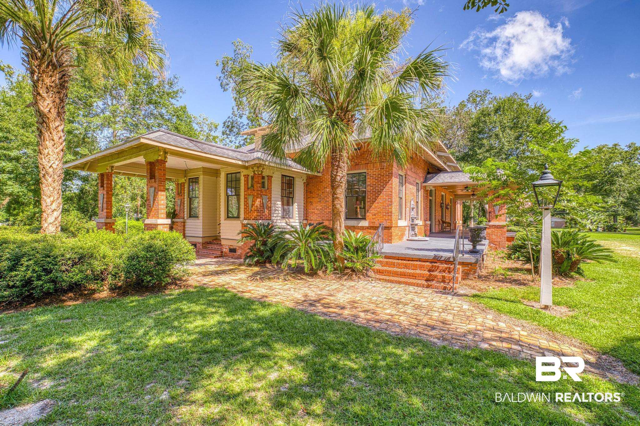 1701 Sowell Road Brewton, AL 36426 - Photo 6 of 83 Rear view of house featuring a yard and covered porch