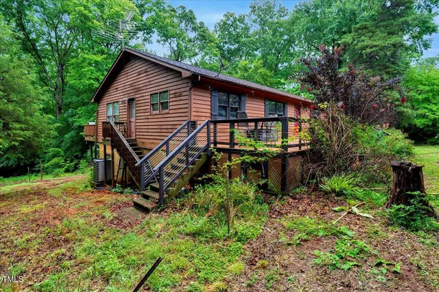 a view of a hallway with windows and entryway