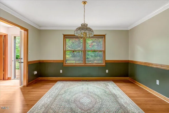 a view of a room with window and wooden floor